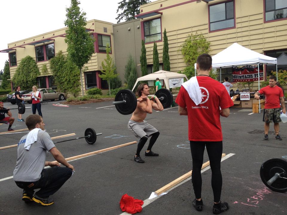 Joe front squatting at CrossFit competition