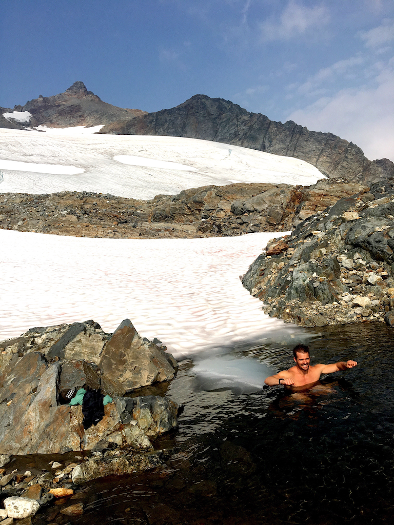 Joe doing a Cold dip in Sahale Glacier