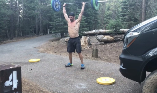 Joe Bauer doing Misfit Athletic power clean and jerks in the woods