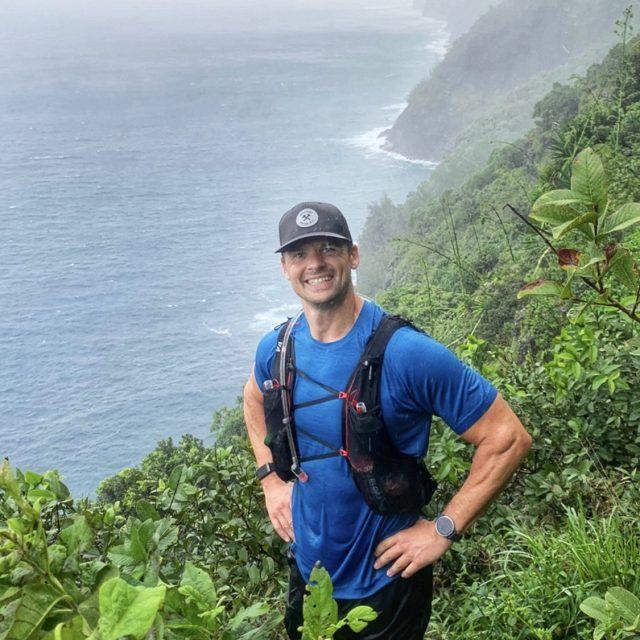 Joe on the Napali Coast wearing Garmin Venu in the pouring rain