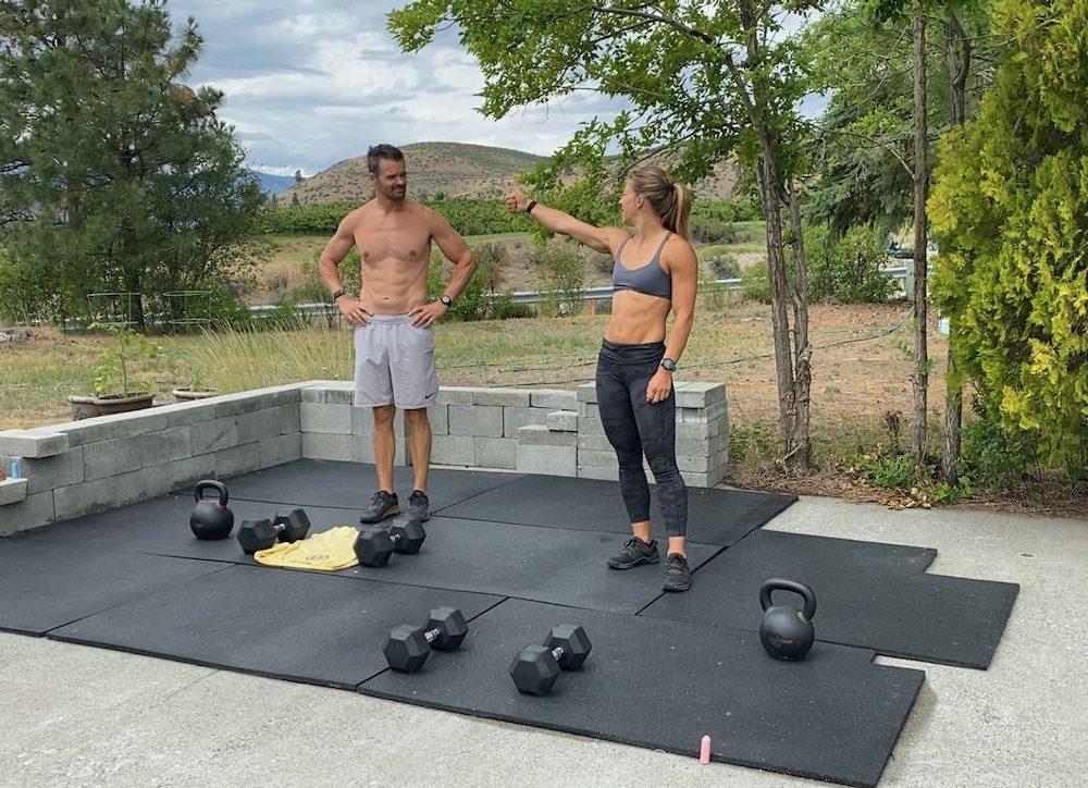Emily giving Joe a thumbs up before an outdoor workout