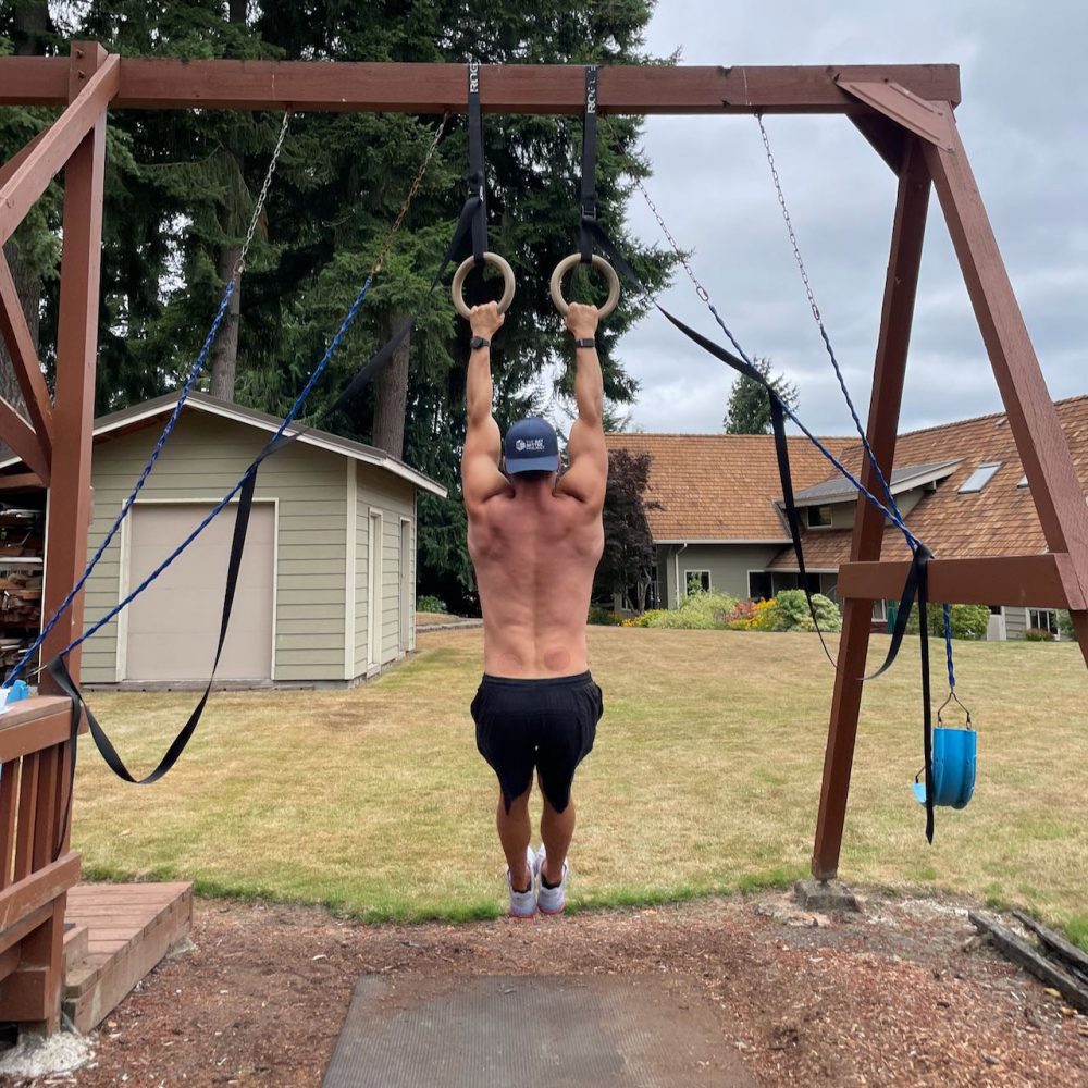 Hanging from rings to Release Back Tension