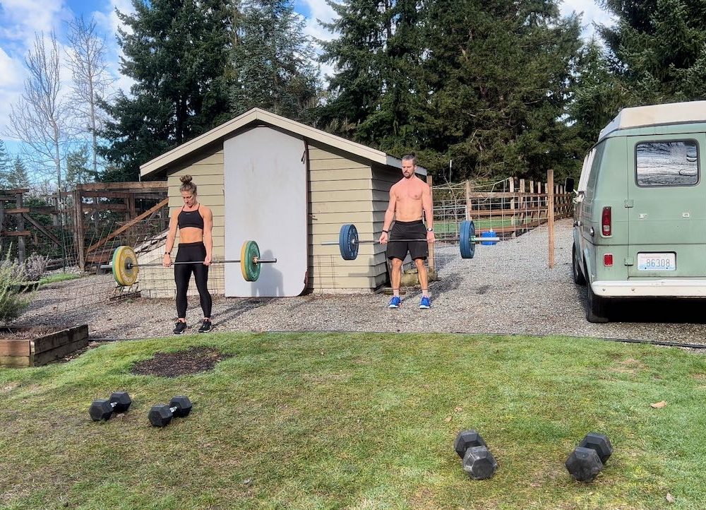 Emily and Joe doing deadlifts in the backyard