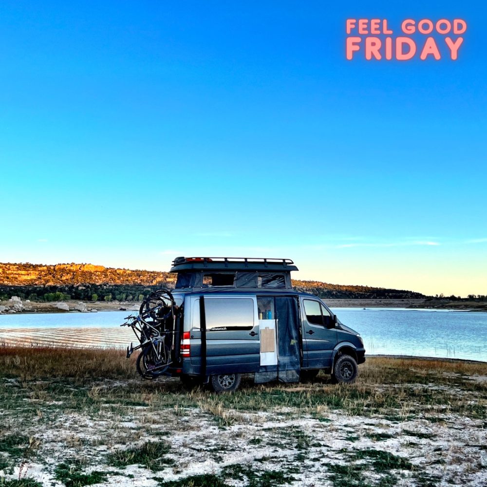 4x4 pop top sprinter van next to lake