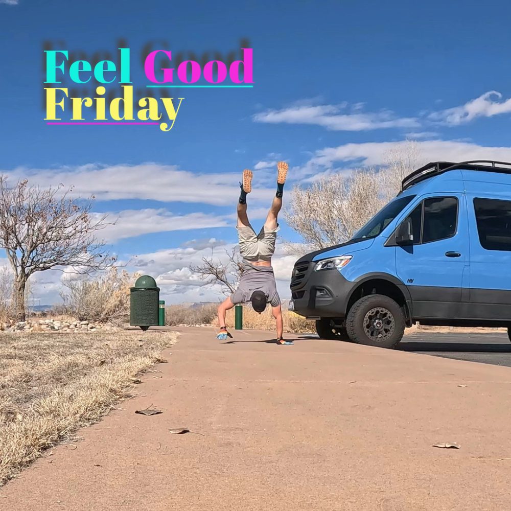 Handstand walking at park in Fruita Colorado next to blue sprinter van.